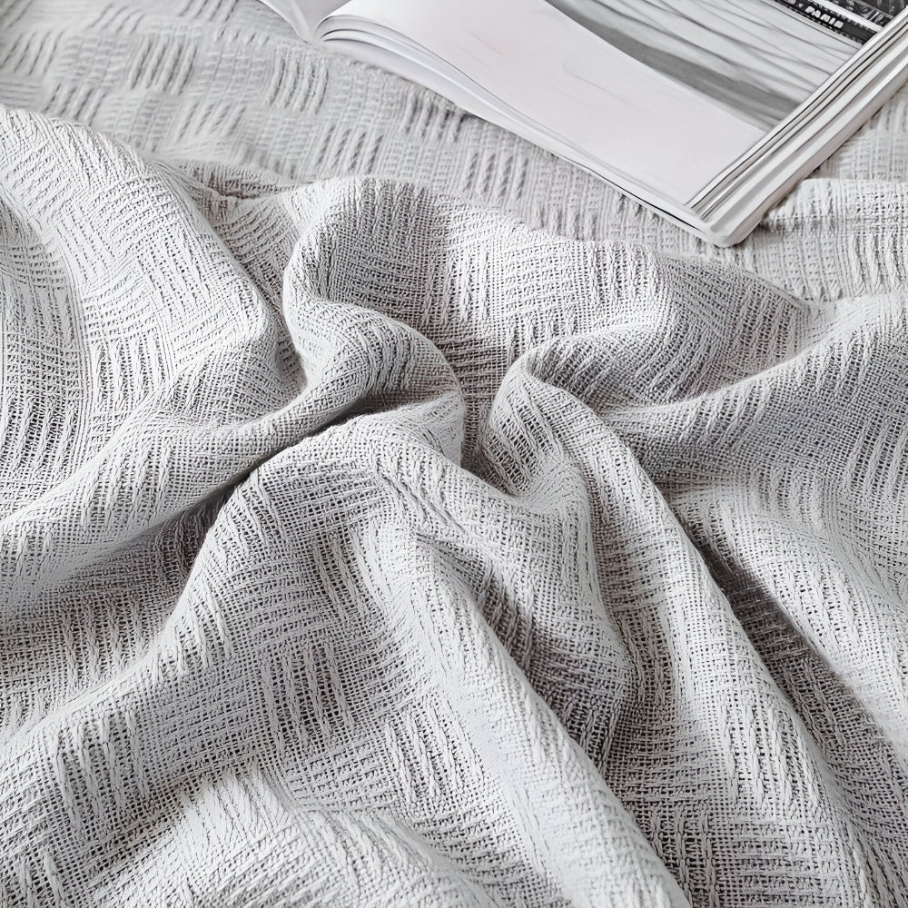 PureBreathe Cozy – Andningsbar Bomullsfleecefilt i Stilren Stickad Design