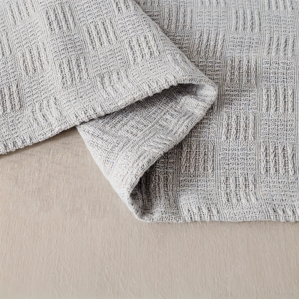 PureBreathe Cozy – Andningsbar Bomullsfleecefilt i Stilren Stickad Design