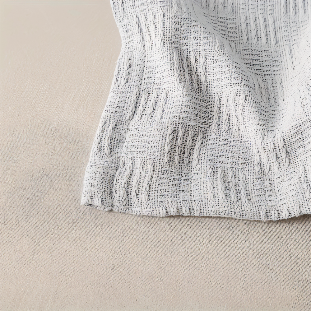 PureBreathe Cozy – Andningsbar Bomullsfleecefilt i Stilren Stickad Design
