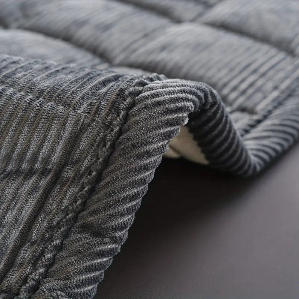 Quiltat soffskydd i mjuk mikrofiber